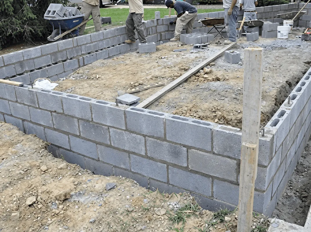 Professionals building a foundation with blocks in Columbia, SC